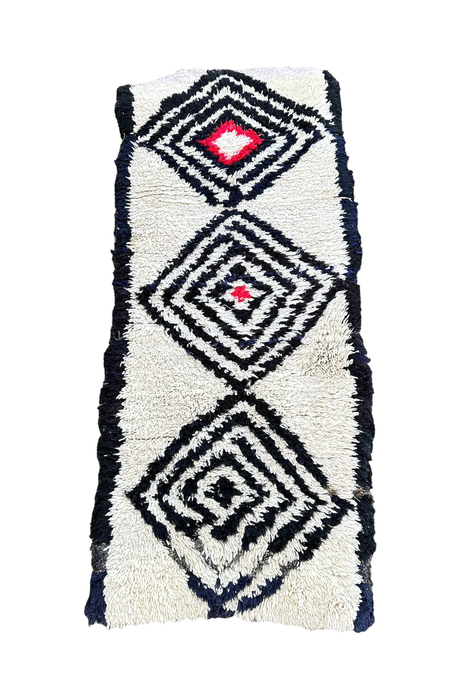 Beni Quarain-tæppe i hvid farve med sorte romber